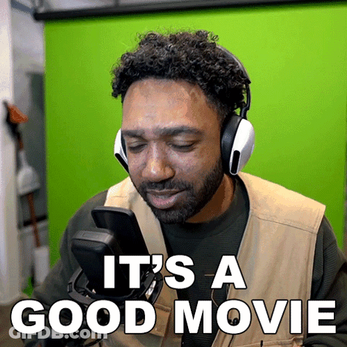 Man In Headphones And Vest Says It's A Good Movie GIF