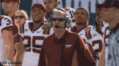 Man In Headphones And VT Shirt With Football Team GIF