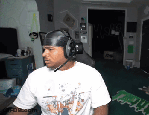 Man In Headphones And White Shirt Saying Mighty GIF