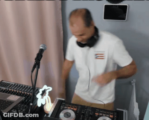 Man In Headphones And White Shirt With Letter M Playing Music GIF