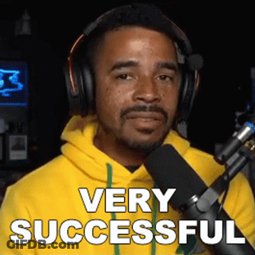 Man In Headphones And Yellow Hoodie Says Very Successful GIF