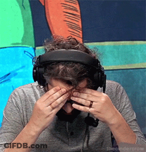 Man In Headphones Covering Eyes With Ring GIF