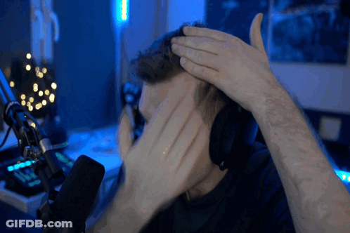 Man In Headphones Covering Face At Microphone GIF
