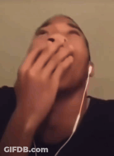 Man In Headphones Covering Mouth GIF