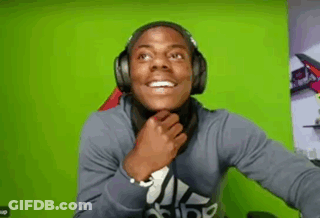 Man In Headphones Covering Mouth GIF