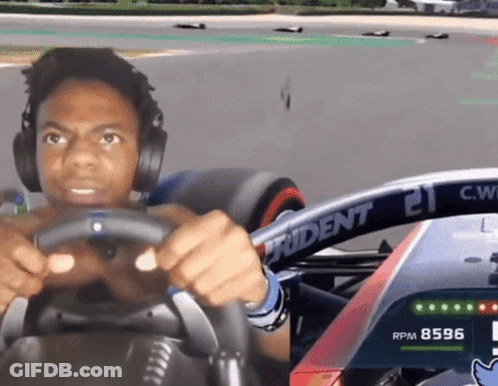 Man In Headphones Driving Race Car With Trident 21 GIF