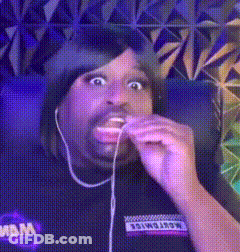 Man In Headphones Eating Cookie Making Funny Face GIF