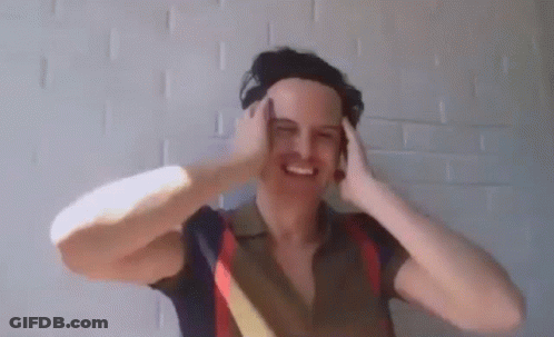 Man In Headphones Funny Face Brick Wall GIF