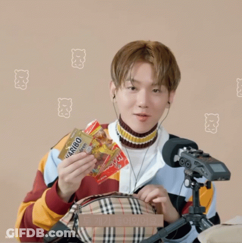 Man In Headphones Holding Burberry Bag At Microphone GIF