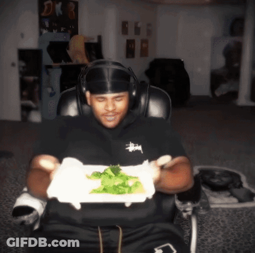 Man In Headphones Holding Plate Of Food GIF