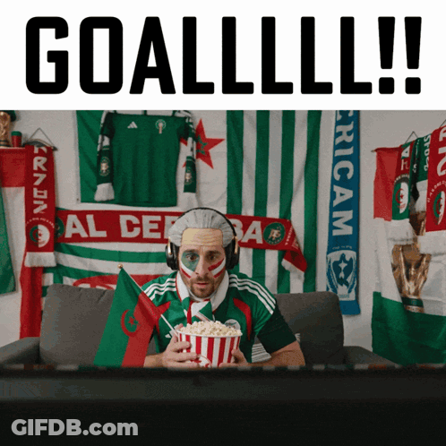 Man In Headphones Holding Popcorn Watching Soccer Goallll GIF