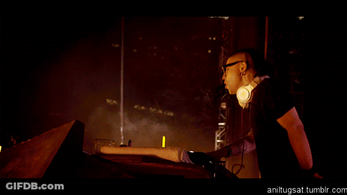 Man In Headphones In Front Of Fire Show GIF