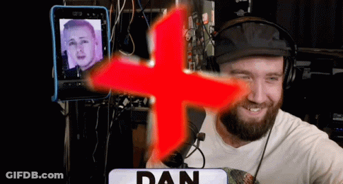Man In Headphones In Front Of Red Cross Saying Dan GIF