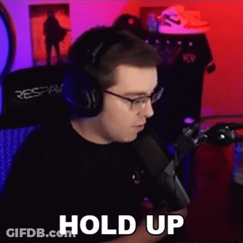 Man In Headphones Making Funny Face At Mic GIF