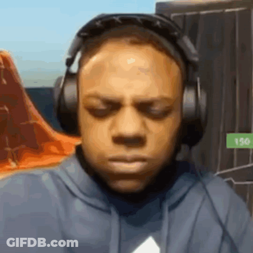 Man In Headphones Making Funny Face Playing Video Game GIF