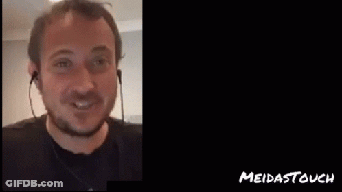 Man In Headphones Next To Sheesh Meidastouch Sign GIF