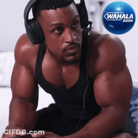 Man In Headphones Playing Video Game Next To Wahala Rocket GIF