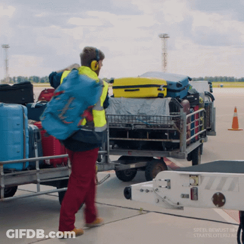 Man In Headphones Pushing Luggage Cart Speel Bewost 184 Staatsloterij.nu GIF