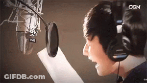 Man In Headphones Singing Into Microphone GIF