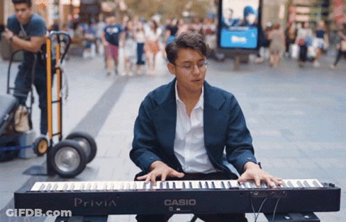 Man In Headphones Sitting By Heartbeat Monitor GIF