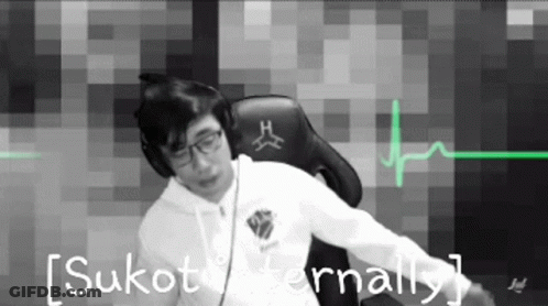 Man In Headphones Sitting In Chair Before Heartbeat Monitor GIF