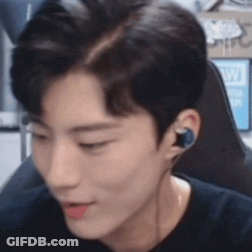 Man In Headphones Sitting In Chair GIF
