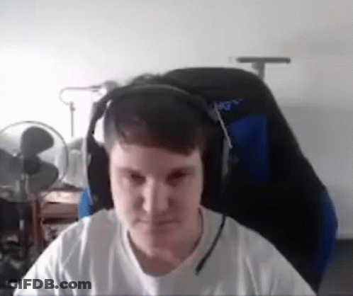 Man In Headphones Sitting In Chair GIF