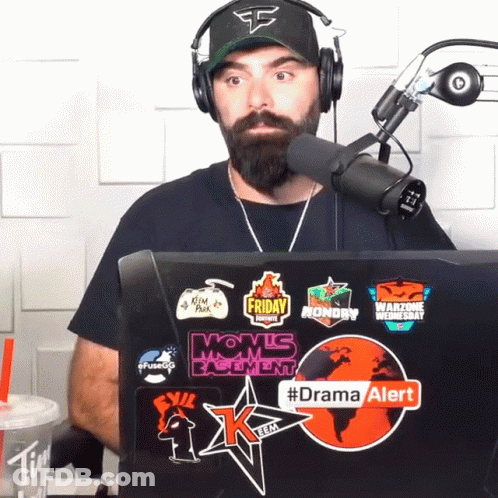 Man In Headphones Sitting In Front Of Laptop With Drama Alert Sticker GIF