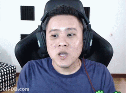 Man In Headphones Sitting In Gaming Chair GIF