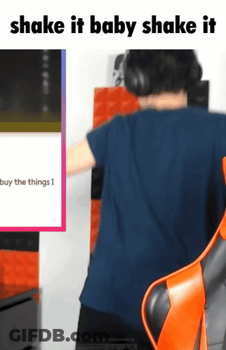 Man In Headphones Sitting In Orange Chair Saying Shake It Baby Shake It GIF