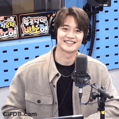 Man In Headphones Smiling At Microphone In Radio Studio GIF