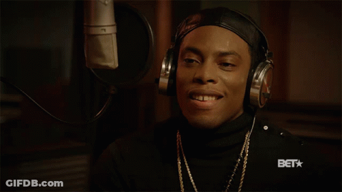 Man In Headphones Smiling At Microphone With BET Logo GIF