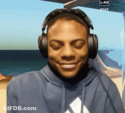 Man In Headphones Smiling At Screen Saying L-Aie Edit GIF
