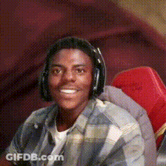 Man In Headphones Smiling In Red Chair GIF