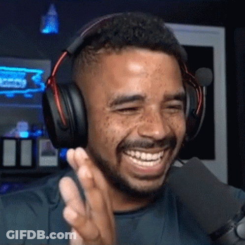 Man In Headphones Smiling Into Microphone GIF