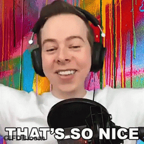 Man In Headphones Standing At Microphone Smiling GIF