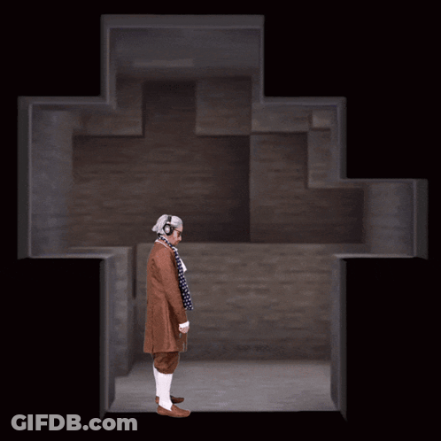 Man In Headphones Standing Before Cross GIF