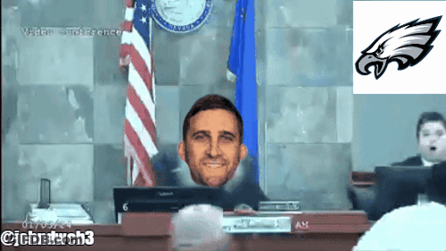 Man In Headphones Watching Vikings Vs Eagles Scoreboard GIF