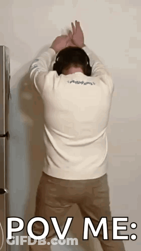 Man In Headphones With Hands Behind Head GIF