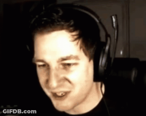 Man In Headphones With Microphone Looking At Camera GIF
