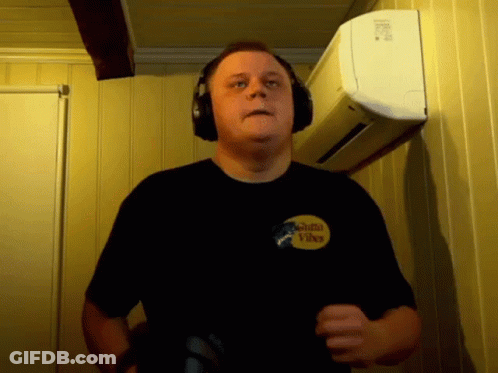 Man In Headphones With Santa Vibes Shirt GIF