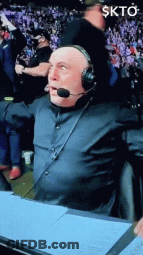Man In Headset In Front Of Crowd Skto GIF