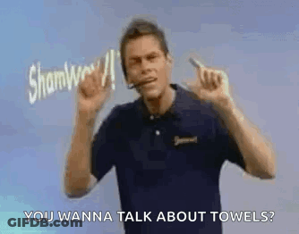 Man In Headset Pointing And Talking About Towels GIF