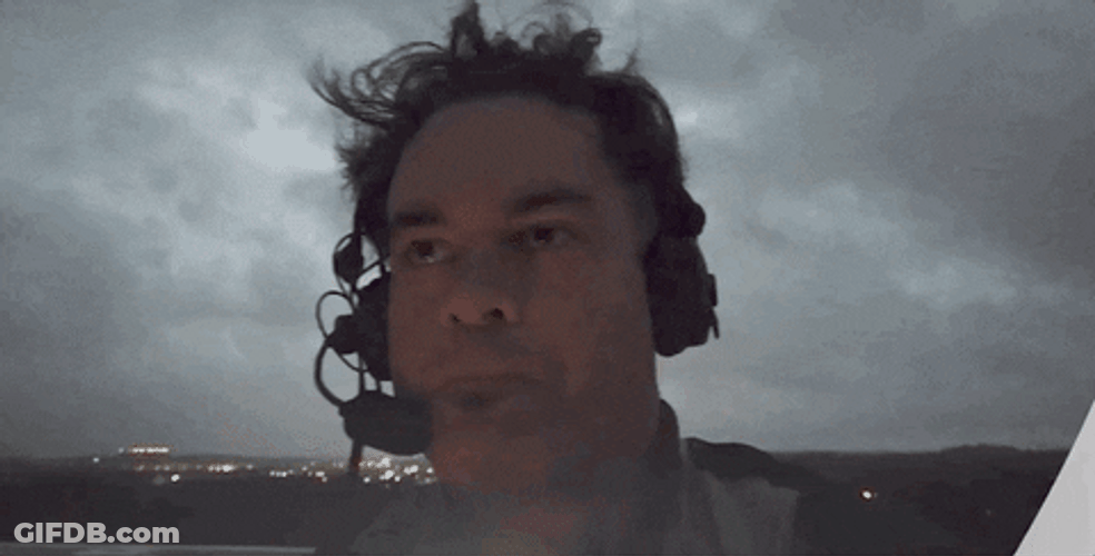 Man In Headset Scared During Thunderstorm GIF
