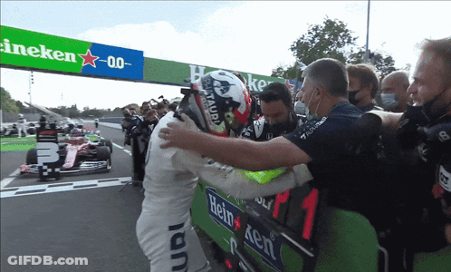 Man In Heineken Shirt Hugging Another Man GIF