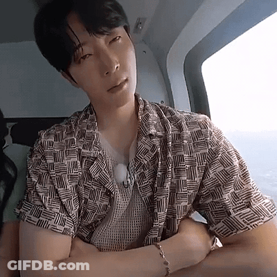 Man In Helicopter Arms Crossed Looking At Camera GIF
