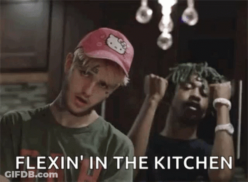 Man In Hello Kitty Hat Beside Another Man GIF