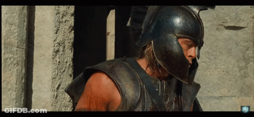 Man In Helmet And Armor At Stone Pillars GIF