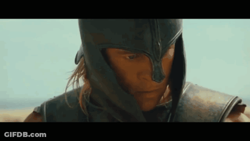 Man In Helmet And Armor Looking Down GIF