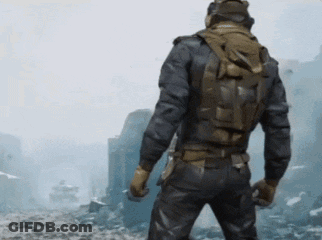 Man In Helmet And Backpack Standing In Field GIF